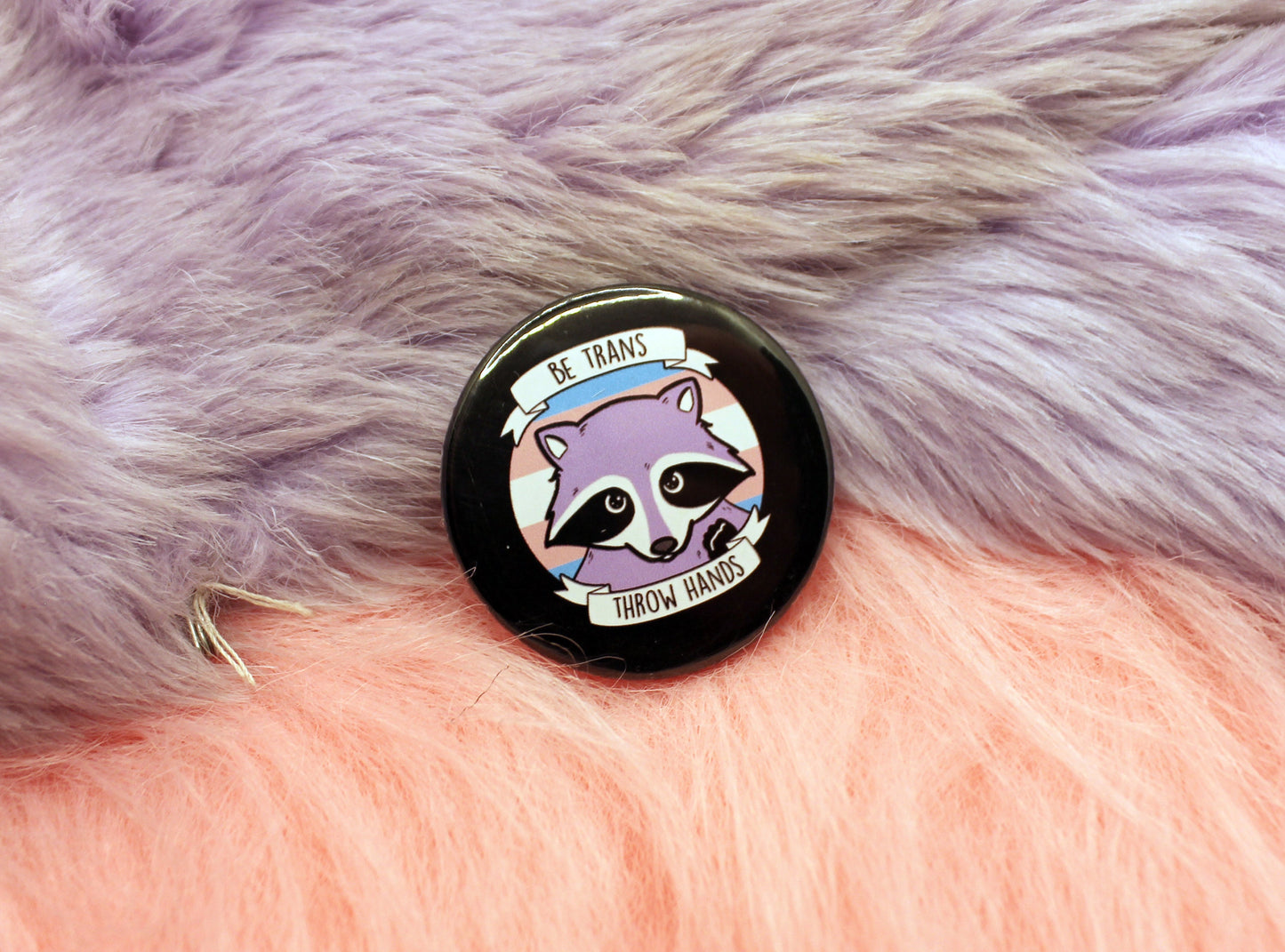 Be Trans Throw Hands Badges (38mm) - transgender raccoon pun badge