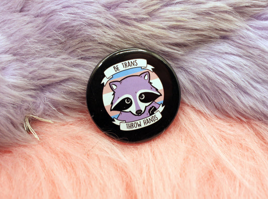 Be Trans Throw Hands Badges (38mm) - transgender raccoon pun badge