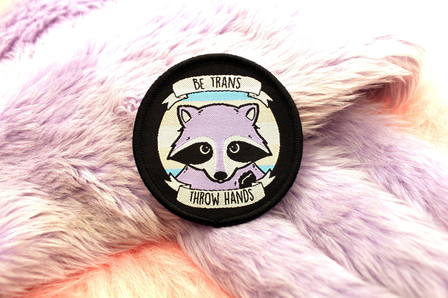 Be Trans Throw Hands Iron-On Patch (60mm) - transgender pride flag raccoon embroidered patch