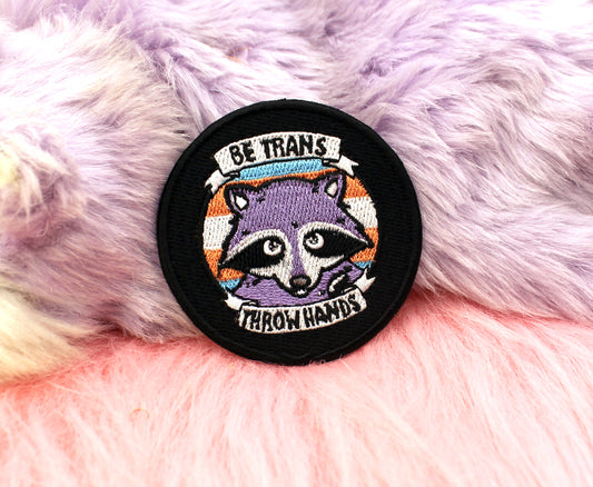 Be Trans Throw Hands Iron-On Patch (60mm) - transgender pride flag raccoon embroidered patch