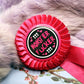 Pink and Black Monster Fucker Rosettes (58mm)
