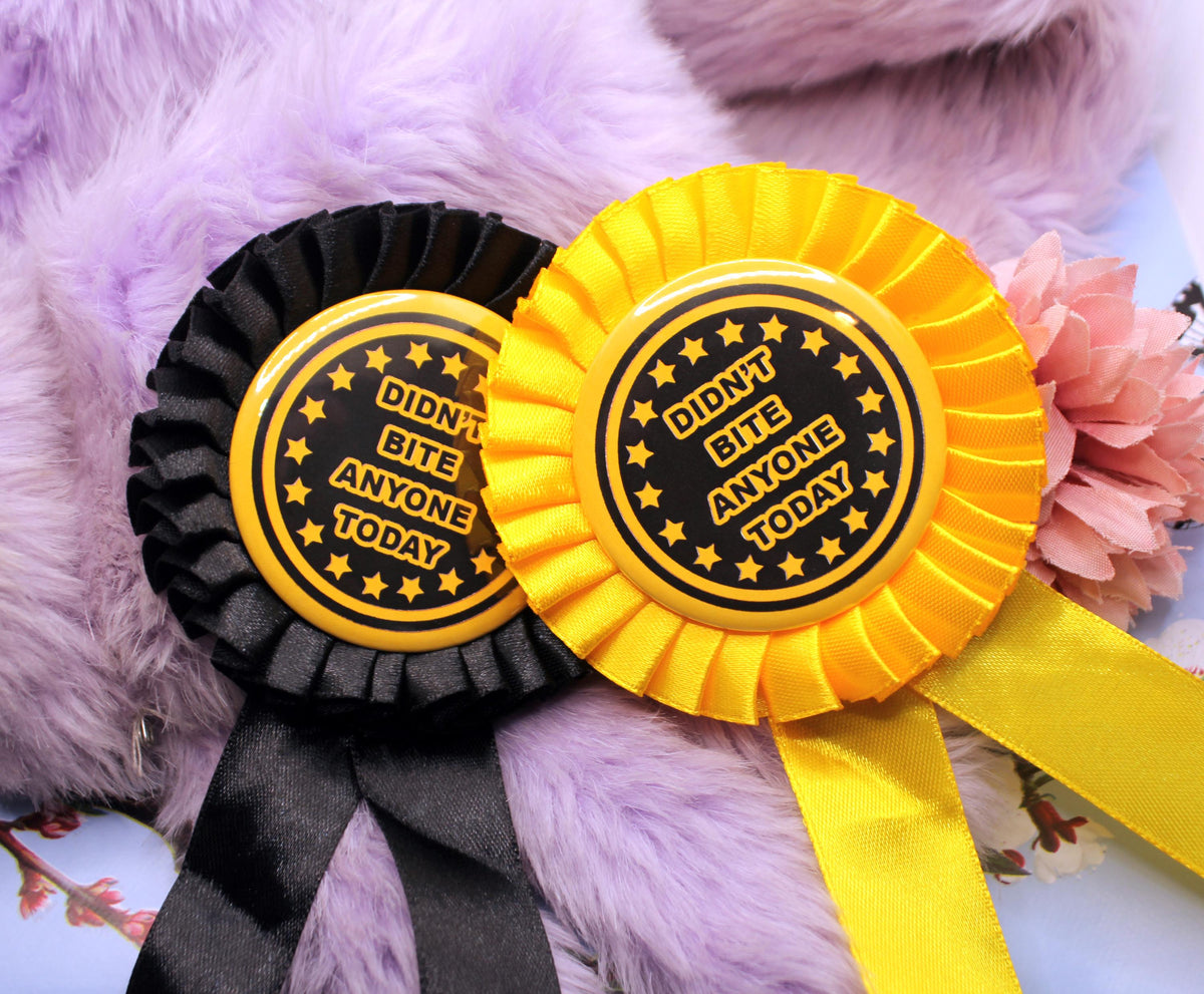 Didn't Bite Anyone Today Gold and Black Rosettes (58mm)