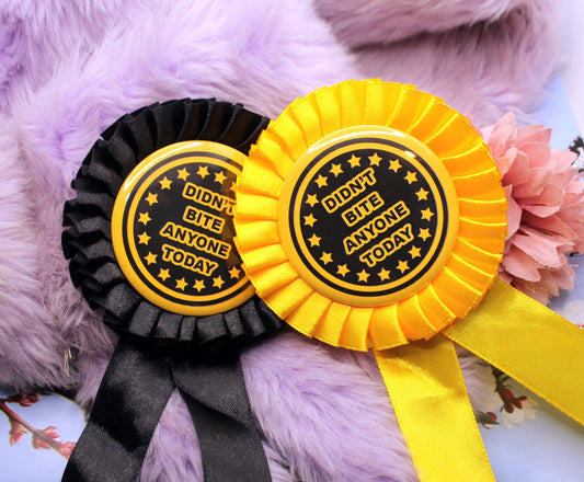 Didn't Bite Anyone Today Gold and Black Rosettes (58mm)