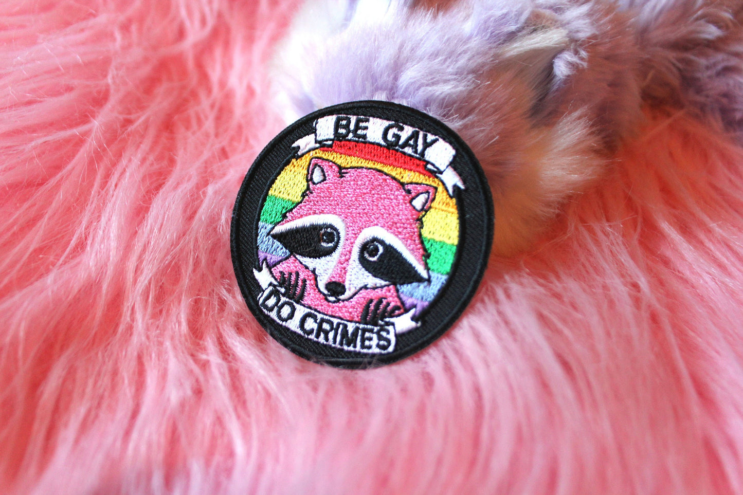 Be Gay Do Crimes Iron-On Patch (60mm) - pink raccoon embroidered patch
